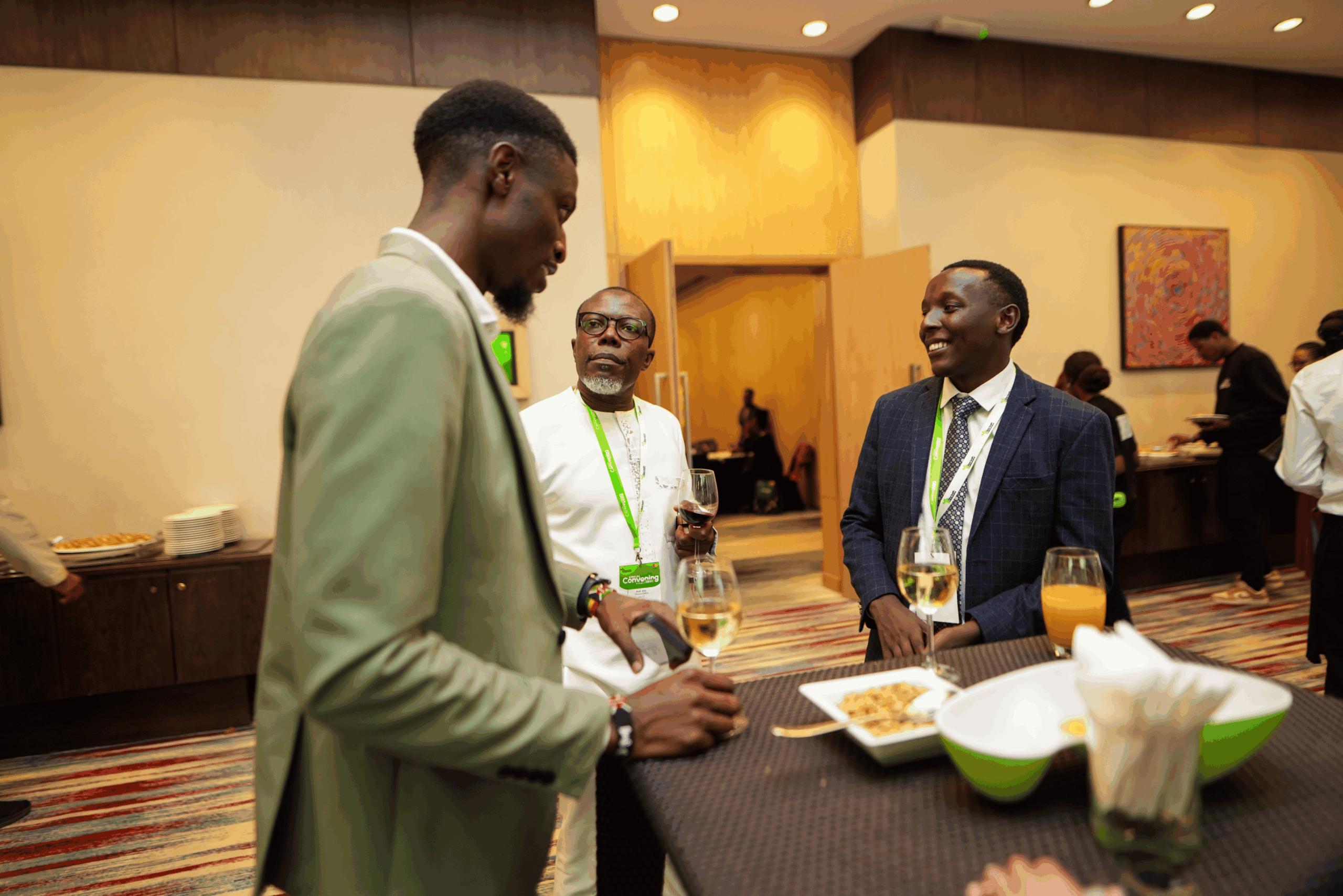 John Nyagaka with Prof. Ellis Owusu-Dabo and another participant at a cocktail
